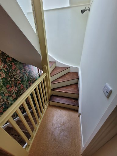 colorful stairwell painted and wall papered